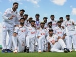 Bangladesh players pose for a team photo as they celebrate after defeating Australia.