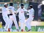 Mehidy Hasan Miraz, right, of Bangladesh is congratulated by teammates. Mehidy Hasan Miraz, right, of Bangladesh is congratulated by teammates.