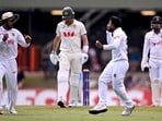 Mehidy Hasan Miraz (2nd R) celebrates with Najmul Hossain Shanto (L) after dismissing Australia's Pat Cummins (2nd L) on the fourth day of the first cricket Test match between Australia and Bangladesh Mehidy Hasan Miraz (2nd R) celebrates with Najmul Hossain Shanto (L) after dismissing Australia's Pat Cummins (2nd L) on the fourth day of the first cricket Test match between Australia and Bangladesh