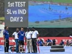 India's head coach Gautam Gambhir (C) inspects the ground after rain delayed the start of play on second day of the first Test cricket match India's head coach Gautam Gambhir (C) inspects the ground after rain delayed the start of play on second day of the first Test cricket match