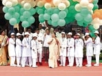 Delhi Chief Minister Rekha Gupta releases tri-coloured balloons during the 80th Independence Day celebrations at Chhatrasal Stadium, in New Delhi, India, on Saturday. (Ishant Chauhan/Hindustan Times)