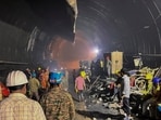 Rescue personnel conduct search operations after water and debris entered a tunnel under construction at a hydroelectric project site, in Uttarakhand, (PTI)