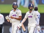 India's KL Rahul, right, and Devdutt Padikkal return to pavillion following lunch during the first test cricket match between India and Sri Lanka India's KL Rahul, right, and Devdutt Padikkal return to pavillion following lunch during the first test cricket match between India and Sri Lanka