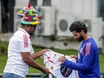 India's Ravindra Jadeja signs autograph for a Sri Lankan fan during Day 2 of the first Test cricket match between India and Sri Lanka, in Galle India's Ravindra Jadeja signs autograph for a Sri Lankan fan during Day 2 of the first Test cricket match between India and Sri Lanka, in Galle