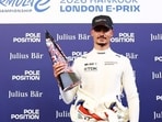 Pascal Wehrlein of Germany and Porsche Formula E Team celebrates with his trophy. (LAT Images)