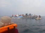 Rescue workers and local boat operators took part in ongoing search and recovery operations near the overturned passenger ferry on Lake Kariba, after the vessel capsized in Kariba, Zimbabwe. (File Photo/Reuters)
