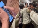When the personnel opens the photo gallery, it is seen that he secretly took pictures of the woman.(Video screengrabs)