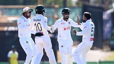 Mehidy Hasan Miraz, right, of Bangladesh is congratulated by teammates. (James Ross/AAP Image via AP) Mehidy Hasan Miraz, right, of Bangladesh is congratulated by teammates. (James Ross/AAP Image via AP)