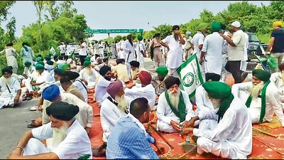 Farmers sit on a road during their gathering near the Khanauri-Data Singhwala border as part of the ‘Kisan Bachao Padyatra’ towards Delhi . (PTI) Farmers sit on a road during their gathering near the Khanauri-Data Singhwala border as part of the ‘Kisan Bachao Padyatra’ towards Delhi . (PTI)