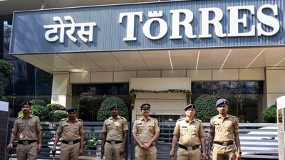 Police personnel stand guard outside Torres Company’s office. (ANI)