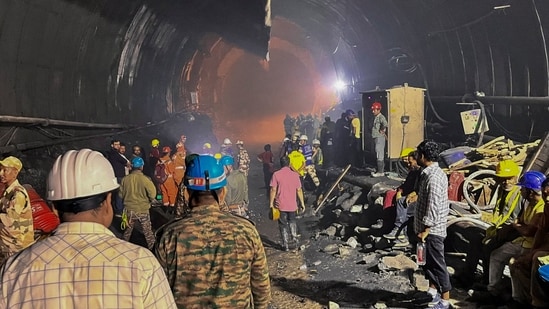 Rescue personnel conduct search operations after water and debris entered a tunnel under construction at a hydroelectric project site, in Uttarakhand, (PTI)