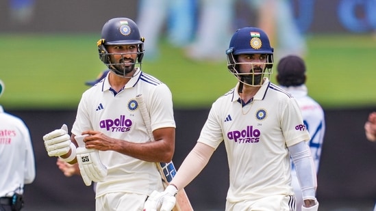 India's KL Rahul, right, and Devdutt Padikkal return to pavillion following lunch during the first test cricket match between India and Sri Lanka (PTI)