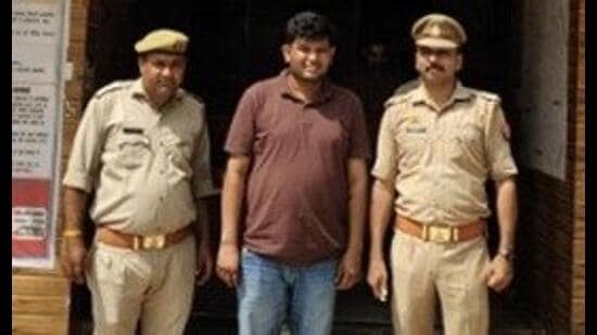 The accused in police custody (Sourced)