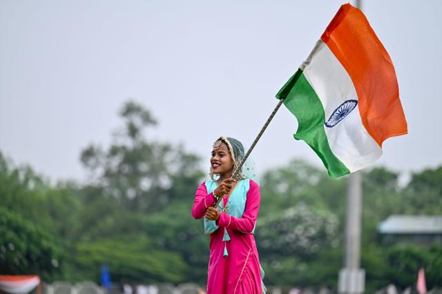 A student waves the Indian flag during their performance at Tau Devi Lal Stadium on Saturday. (Parveen Kumar/HT) A student waves the Indian flag during their performance at Tau Devi Lal Stadium on Saturday. (Parveen Kumar/HT)
