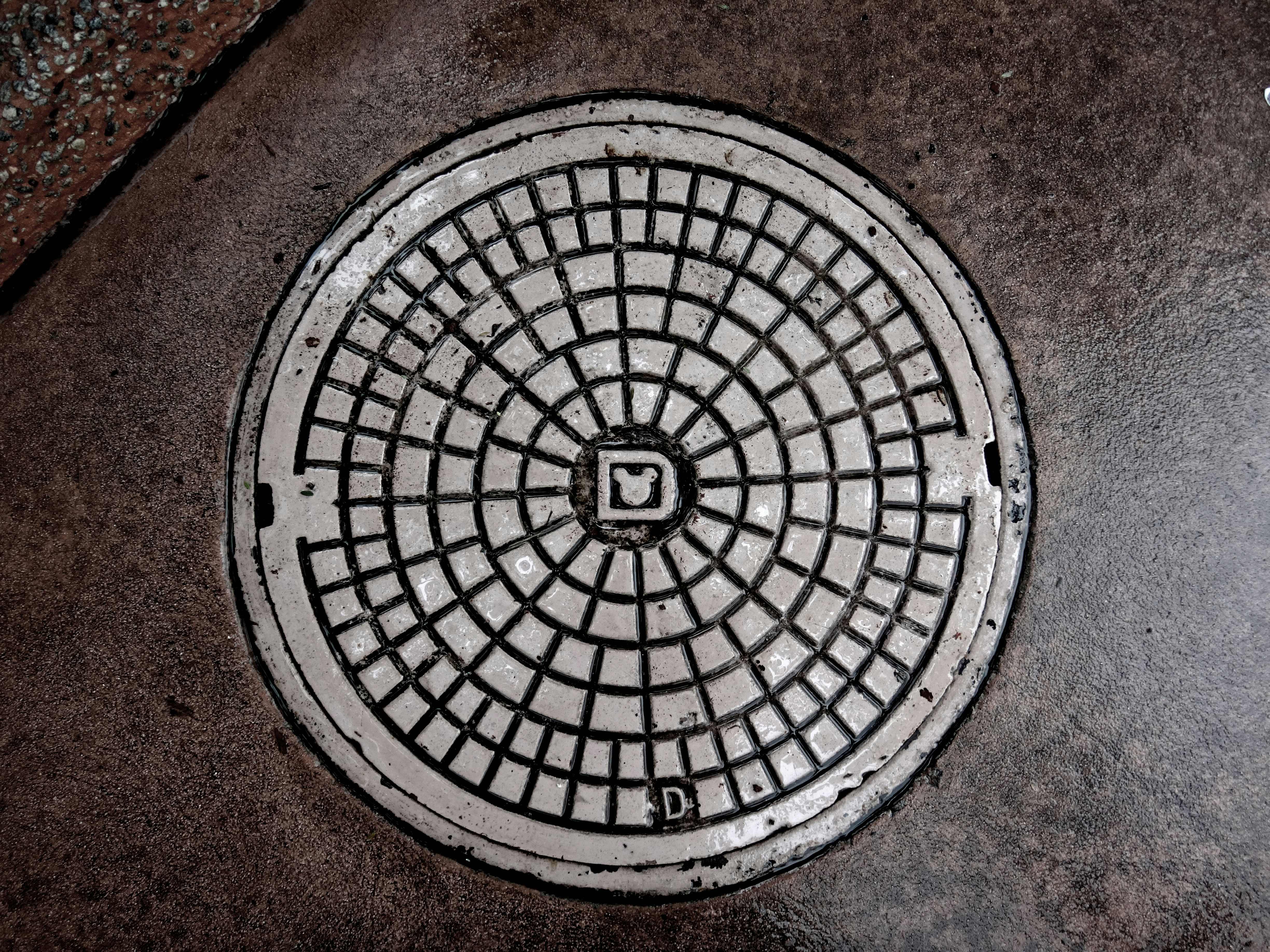 Circular manhole covers are preferred due to their ability to evenly distribute loads and avoid stress concentrations. (Unsplash) Circular manhole covers are preferred due to their ability to evenly distribute loads and avoid stress concentrations. (Unsplash)