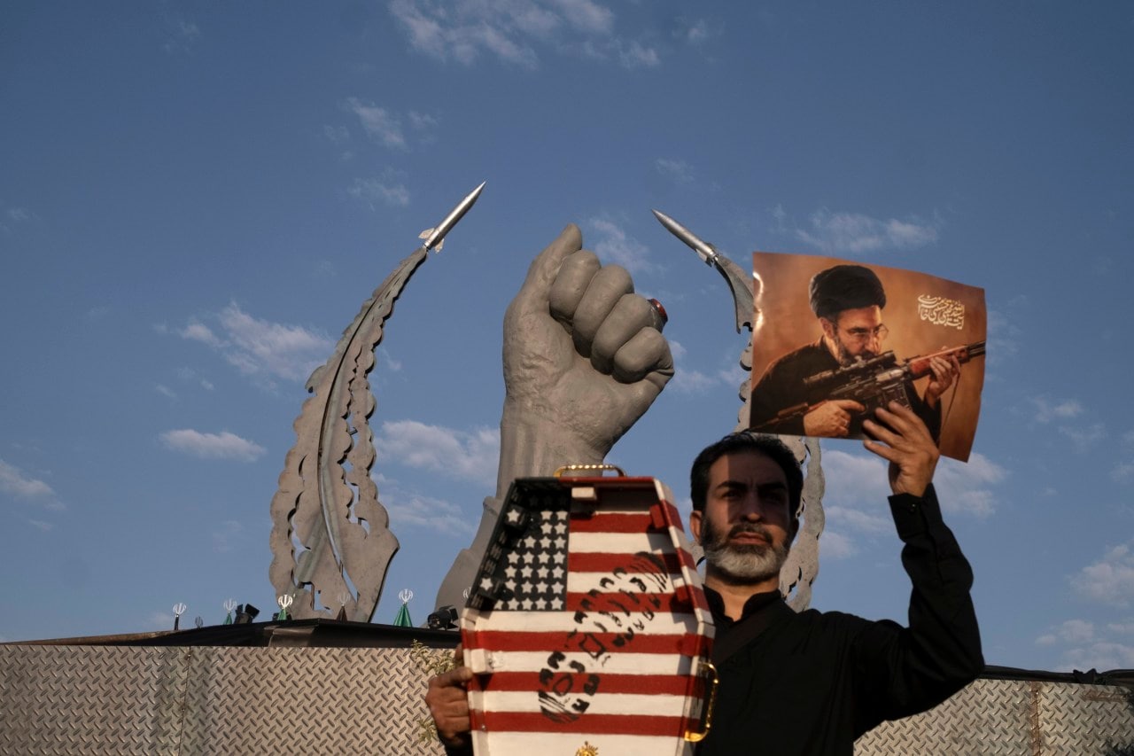 An Iranian holds a picture of Supreme Leader Ayatollah Mojtaba Khamenei in Tehran. An Iranian holds a picture of Supreme Leader Ayatollah Mojtaba Khamenei in Tehran.