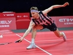 Denmark's Anders Antonsen hits a return during a match.