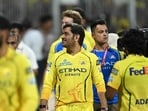 Chennai Super Kings' Indian cricket player MS Dhoni (C) greets the fans. 