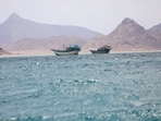 Boats float near the coast of Bab el-Mandeb, Yemen 