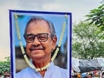 Mourners gather around a vehicle carrying the mortal remains during the funeral procession of former West Bengal assembly deputy speaker and veteran Trinamool Congress (TMC) leader Asish Banerjee. 