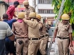 Tarapith: Rescue personnel carry out operations after a fire broke out at a private hotel in Tarapith, in Birbhum district, West Bengal, Monday,