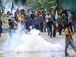 Protesters during a face off with police on the Sector 51-52 dividing road. (Ravi Kumar/HT)