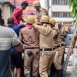 Tarapith: Rescue personnel carry out operations after a fire broke out at a private hotel in Tarapith, in Birbhum district, West Bengal, Monday,