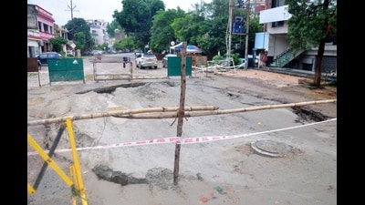A stretch of road caved in at Vikas Nagar, Sector 2, in Lucknow on Monday, following heavy rainfall amid ongoing sewage work (Deepak Gupta/HT) A stretch of road caved in at Vikas Nagar, Sector 2, in Lucknow on Monday, following heavy rainfall amid ongoing sewage work (Deepak Gupta/HT)