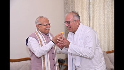 Haryana Rajya Sabha member Sanjay Bhatia (right) during his meeting with Union power minister Khattar in Panipat on Monday.