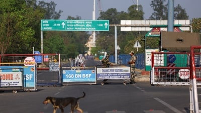 BSF soldiers stand behind barricades at the Attari-Wagah border crossing near Amritsar. (REUTERS)