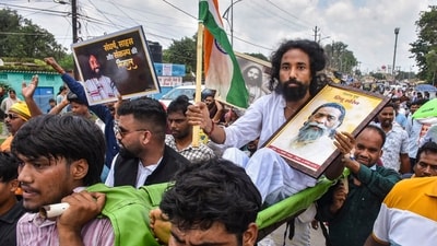 Student leader Devendra Nath Mahto being carried during a march towards Jharkhand Assembly amid a protest over alleged irregularities in the 14th JPSC examination, JSSC-CGL and other recruitment tests, demanding resignation of Jharkhand Chief Minister Hemant Soren and CBI probe on paper leaks. (PTI) Student leader Devendra Nath Mahto being carried during a march towards Jharkhand Assembly amid a protest over alleged irregularities in the 14th JPSC examination, JSSC-CGL and other recruitment tests, demanding resignation of Jharkhand Chief Minister Hemant Soren and CBI probe on paper leaks. (PTI)