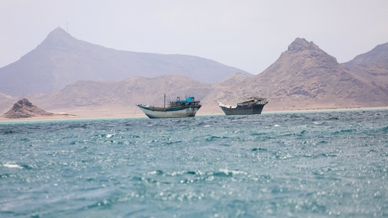 Boats float near the coast of Bab el-Mandeb, Yemen 