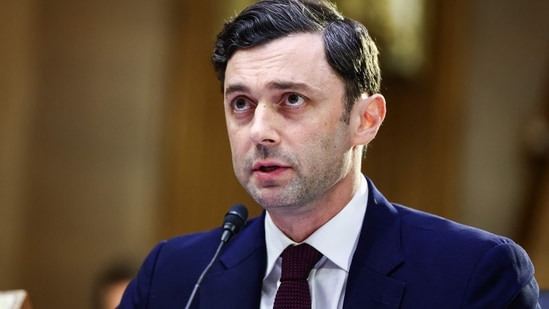 Senator Jon Ossoff criticized President Trump for focusing on personal travel with aide Natalie Harp instead of addressing vital issues like the conflict in Iran. (Getty Images via AFP)
