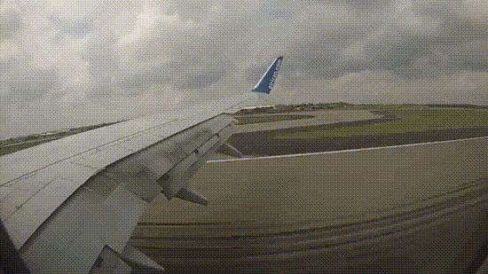 Why do the panels on an airplane wing open mid-air before landing?