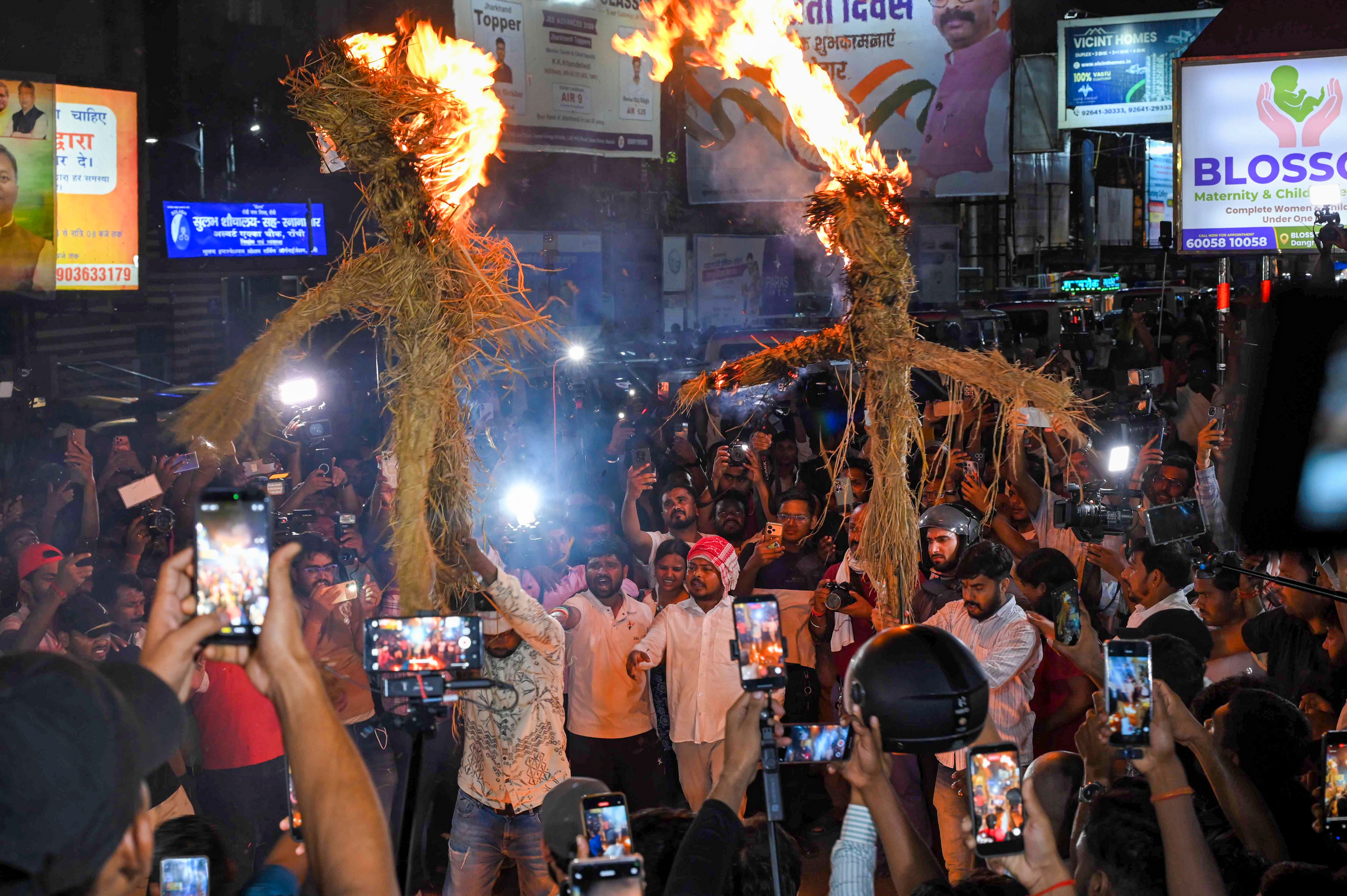 Job aspirants and students burn effigies during a protest against the Jharkhand government demanding a probe into alleged recruitment exam irregularities conducted by the JPSC and JSSC. (PTI) Job aspirants and students burn effigies during a protest against the Jharkhand government demanding a probe into alleged recruitment exam irregularities conducted by the JPSC and JSSC. (PTI)