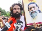 Ranchi, Aug 10 (ANI): Student leader Devendra Nath Mahto holds the portrait of Padma Bhushan awardee and former state CM late Shibu Soren as he speaks to the media during the 'Vidhan Sabha gherao' march, in Ranchi on Monday. (ANI Video Grab)