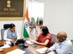 Union Education Minister Pralhad Joshi chairs a meeting with the Secretary, Department of Higher Education, DG NTA, and other senior officials, in New Delhi on Monday. 