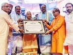 Chief minister Yogi Adityanath during a programme to launch the e-PoS-based fair price shop dealer feedback system in Lucknow on Monday. (ANI PHOTO)
