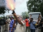 A police personnel fires tear gas shells to disperse activists and supporters of the Cockroach Janta Party (CJP) during a protest demanding the resignation of India's Education Minister Dharmendra Pradhan over alleged NEET examination irregularities in New Delhi on July 20.