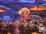 ZZ Top drummer Frank Beard died at 77 after hospice care and health problems, while the band canceled two upcoming shows. (Photo by FRANCOIS NASCIMBENI / AFP)