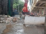 Images and videos showed broken granite slabs and tiles scattered on the road beneath the under-construction Medetiya Nagar metro station