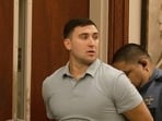 Jake Lang is led out of Judge H. Reid Poland III's courtroom in handcuffs during livestreamer Dalton Eatherly's hearing, Thursday, May 21, 2026, in Clarksville, Tenn.