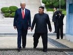 (FILES) North Korea's leader Kim Jong Un and US President Donald Trump cross south of the Military Demarcation Line that divides North and South Korea, after Trump briefly stepped over to the northern side, in the Joint Security Area (JSA) of Panmunjom in the Demilitarized zone (DMZ) on June 30, 2019. South Korea's defence ministry said August 17, 2026 that its joint military exercise with the United States has started after President Donald Trump's announcement it would be scaled back. Trump said he was 
