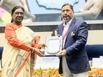 President Droupadi Murmu presenting the Sangeet Natak Akademi Award 2025 to Rakesh Sinha during a ceremony in New Delhi