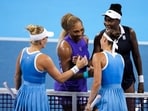 Serena Williams and Venus Williams meet with Peyton Stearns of the United States and Marta Kostyuk of Ukraine, after their doubles match during the Cincinnati Open