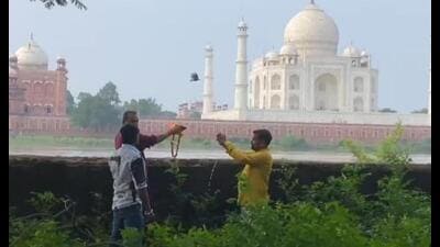 ABHM activists offering symbolic prayers at Mehtab Bagh in Agra, considering the Taj Mahal as a Shiva Temple, on the third Monday of Sawan. (Sourced)