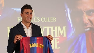 Spanish international footballer Rodri poses with a jersey bearing his name. Spanish international footballer Rodri poses with a jersey bearing his name.