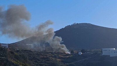 Smoke billows from the site of a helicopter crash on the island of Sifnos, Greece. (File Photo/Reuters)