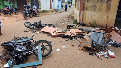 A motorcycle, furniture, and other articles belonging to the Shagya forest office lay damaged on a road after relatives of alleged poachers, who were killed in an exchange of fire with forest personnel in the Datti forest area under the Shagya range, vandalised the forest office after the encounter, at Hanur taluk, Karnataka. (File Photo/PTI) A motorcycle, furniture, and other articles belonging to the Shagya forest office lay damaged on a road after relatives of alleged poachers, who were killed in an exchange of fire with forest personnel in the Datti forest area under the Shagya range, vandalised the forest office after the encounter, at Hanur taluk, Karnataka. (File Photo/PTI)