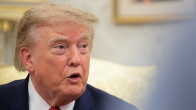 U.S. President Donald Trump speaks as he hosts 16-year-old lifeguard Ryder Williams, who saved a child off the coast of Santa Cruz, California, last month, Nathaniel Rai, the child saved by Williams, and Nathaniel's family members in the Oval Office at the White House in Washington, D.C., U.S., August 17, 2026. (REUTERS)